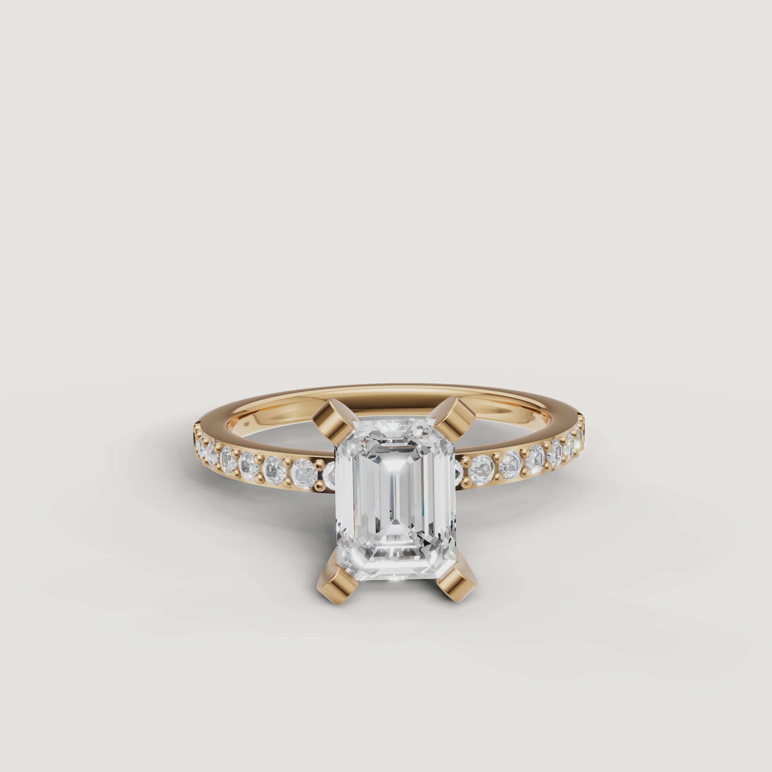 Video showcase of the Raul Diamonds emerald cut solitaire ring in yellow gold, featuring the hall-of-mirrors light reflection and sparkling pavé diamond band.