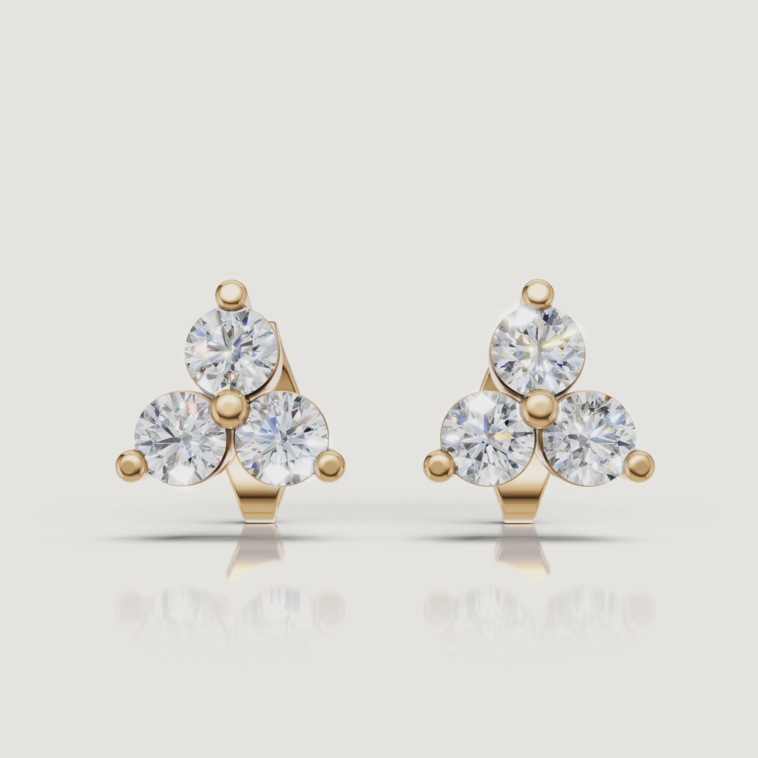 Yellow gold three stone diamond stud earrings sparkling jewelry video Raul Diamonds