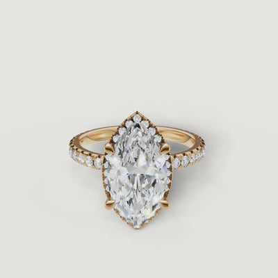 Cinematic 360-degree view of a Raul Diamonds Marquise Cut Hidden Halo ring in 18k yellow gold with a shimmering pavé diamond band