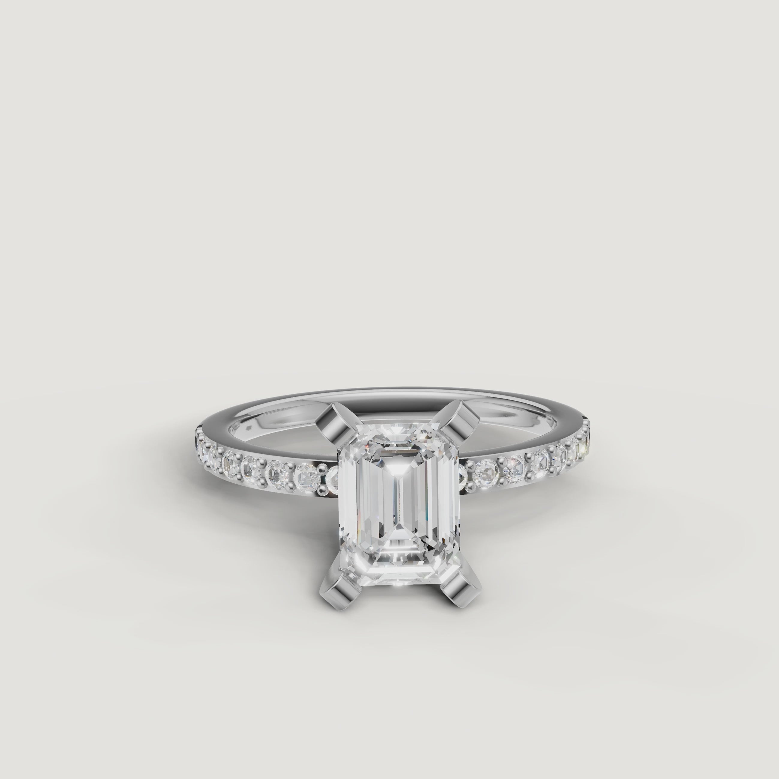 High-definition 360 video of the Raul Diamonds white gold emerald cut engagement ring, focusing on the brilliant light performance and seamless pavé setting.