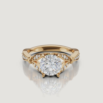 Rotating video of Raul Diamonds round cut lab grown diamond engagement ring in 14K yellow gold with pavé accents