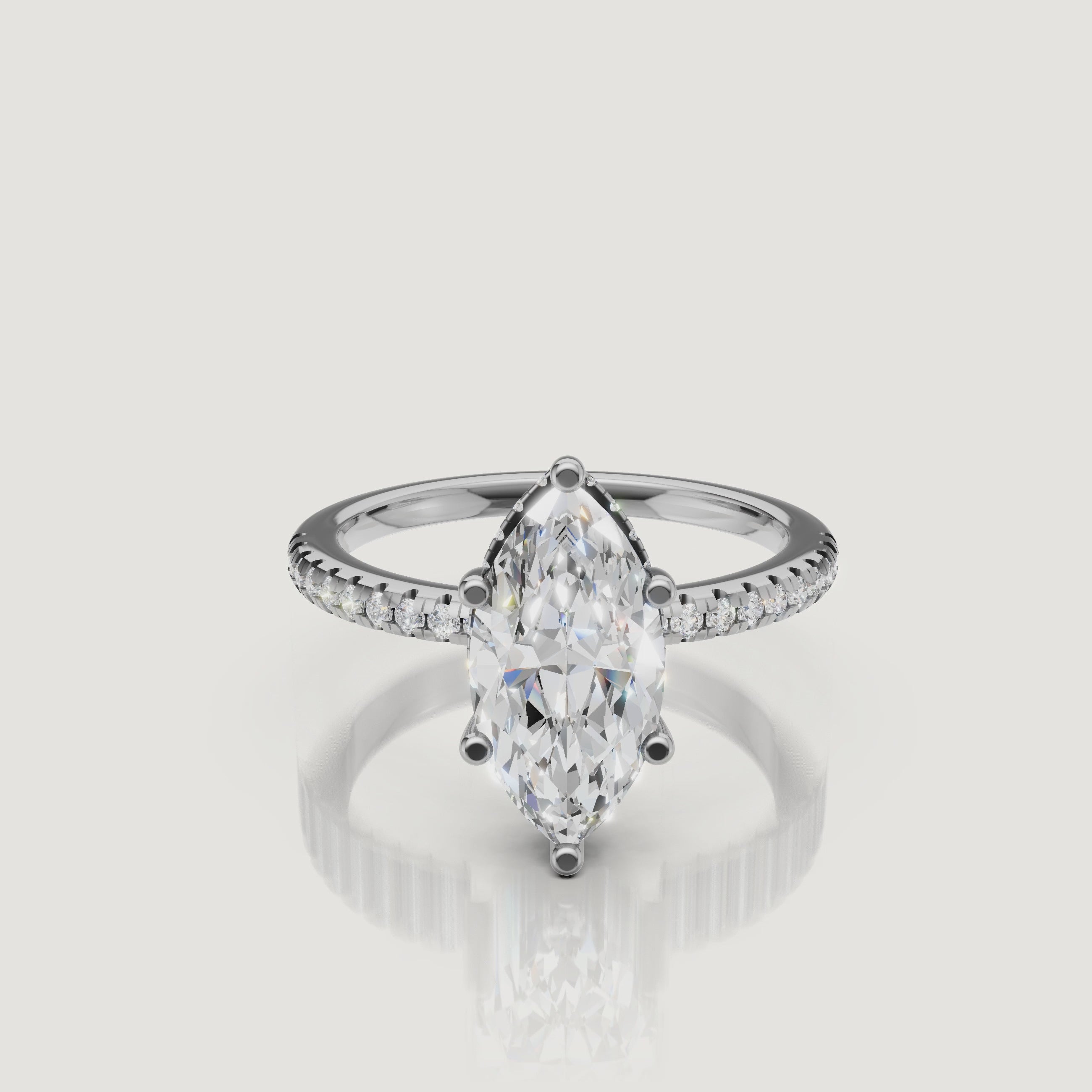 cinematic showcase of marquise shaped lab grown diamond engagement ring with micro pavé band