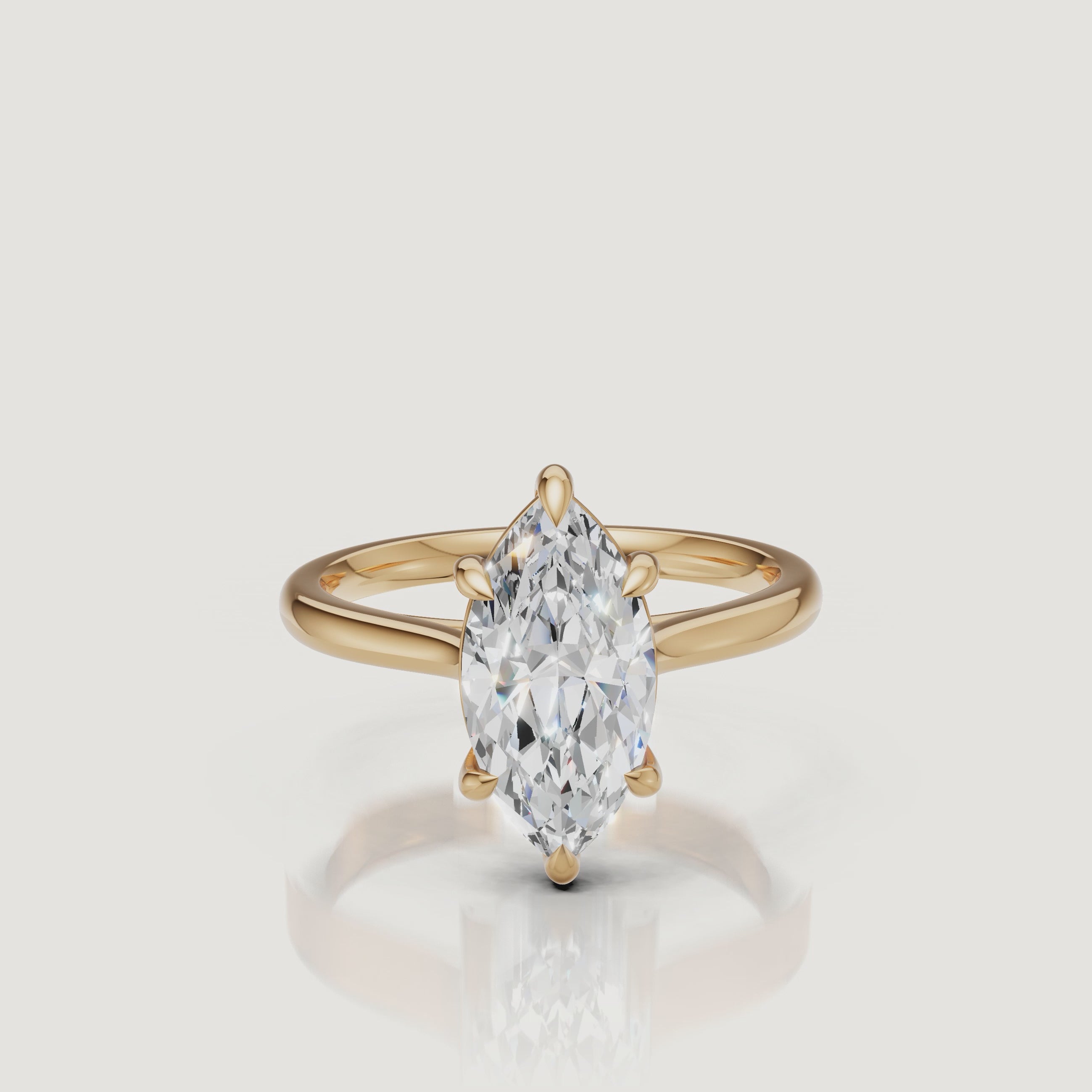 Rotating video of Raul Diamonds marquise cut yellow gold solitaire engagement ring with polished band