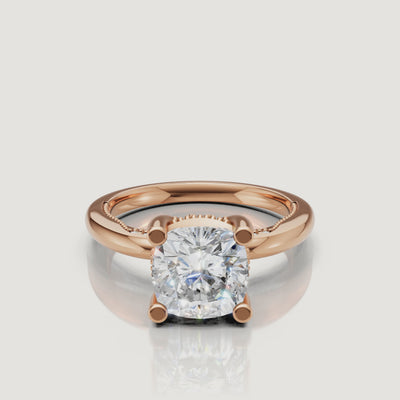 Close-up video of a rose gold cushion cut diamond ring by Raul Diamonds, capturing the warm pink metal tones and crushed-ice brilliance