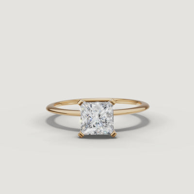 Cinematic video of a princess cut lab grown diamond solitaire engagement ring in yellow gold by Raul Diamonds featuring macro diamond sparkle, elegant hand movement, warm luxury lighting, and premium bridal jewelry styling