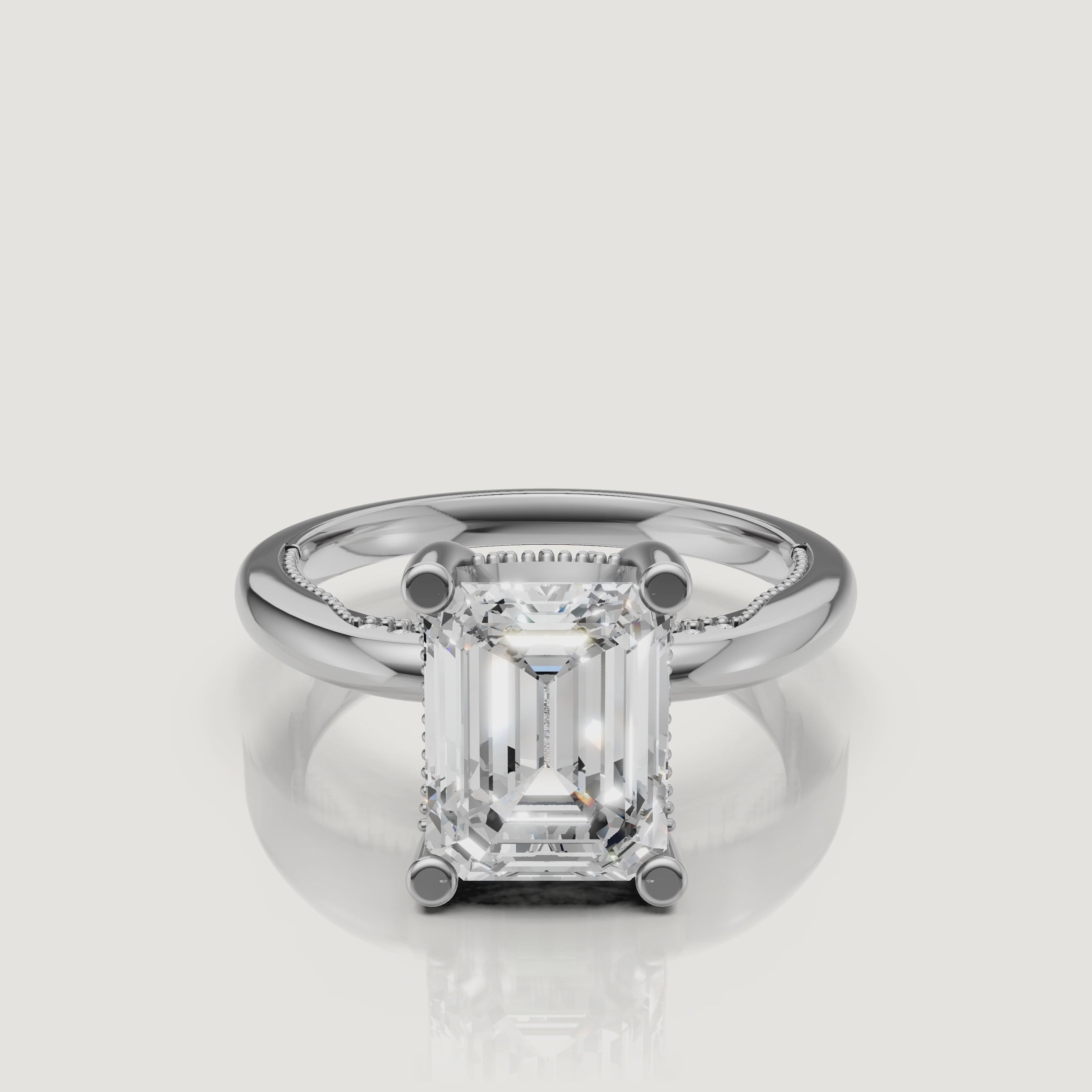 Macro video of a white gold emerald cut solitaire ring from Raul Diamonds, displaying the sharp geometric lines and brilliant white light performance.