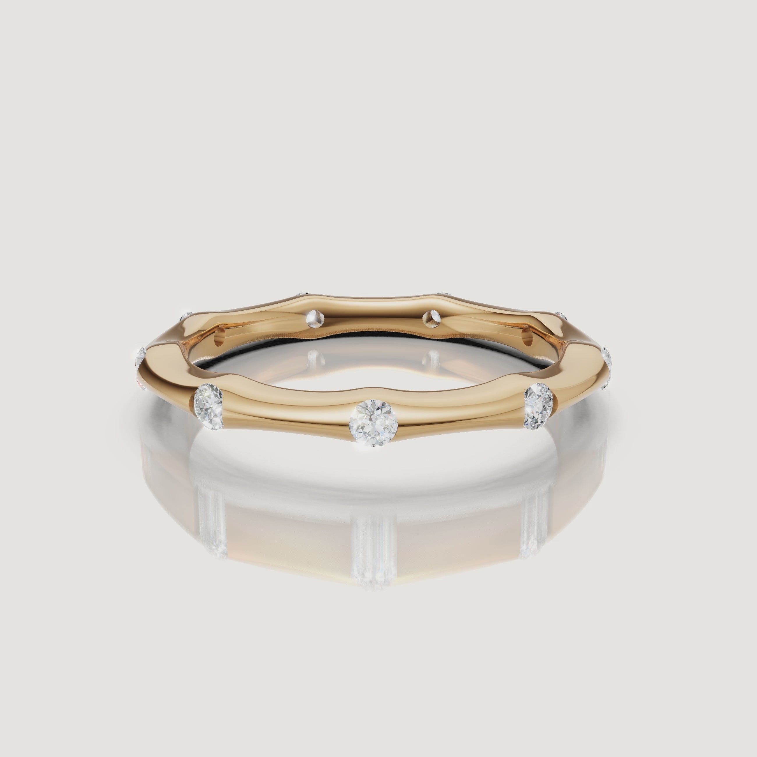 360 degree video of Raul Diamonds yellow gold curved diamond wedding band with bezel set round diamonds and minimalist luxury design