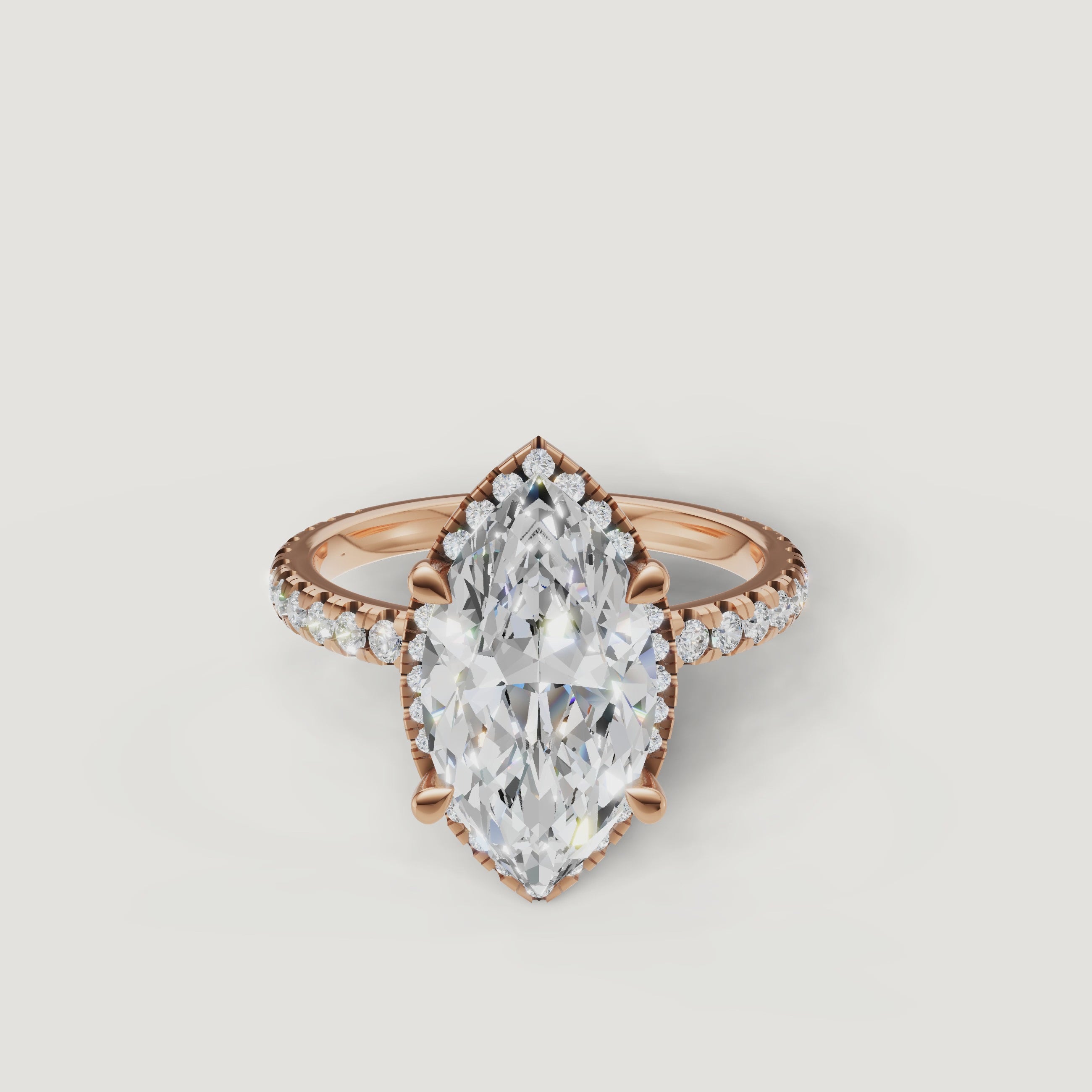 Close-up sparkle test of a rose gold Marquise diamond ring featuring a hidden halo and pavé accents by Raul Diamonds