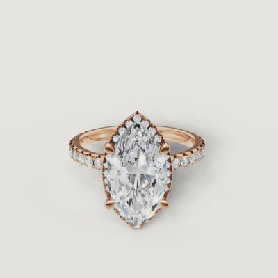 Close-up sparkle test of a rose gold Marquise diamond ring featuring a hidden halo and pavé accents by Raul Diamonds