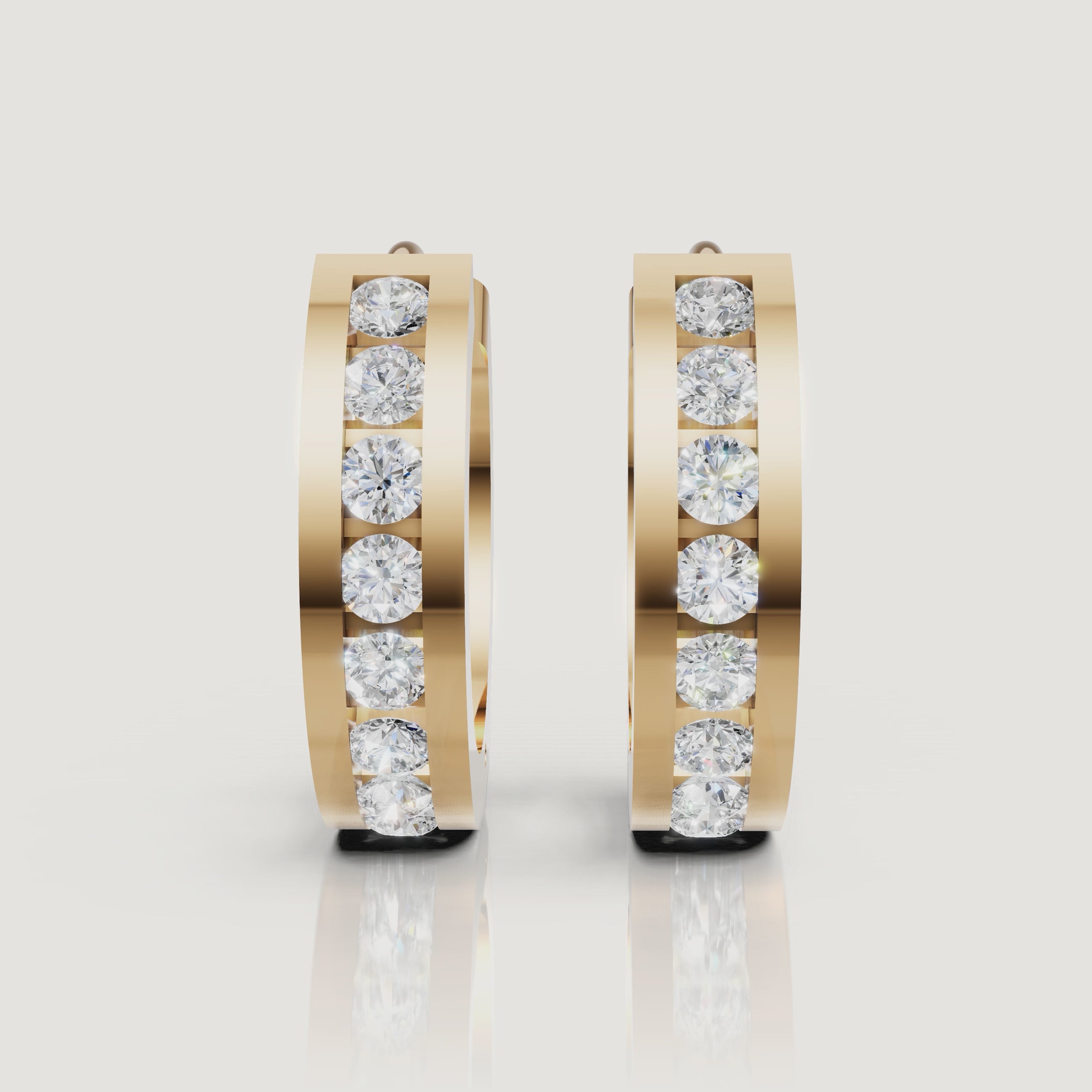 Yellow gold diamond hoop earrings video showcasing sparkling round diamonds by Raul Diamonds
