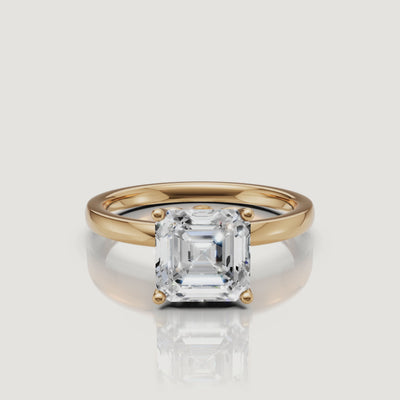 High-definition video showcase of a Raul Diamonds Asscher cut diamond ring in 14k yellow gold, rotating to show the vintage step-cut facets and high-polish finish