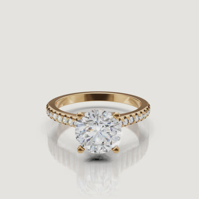 360 view of round cut lab grown diamond pavé engagement ring in 14K yellow gold by Raul Diamonds