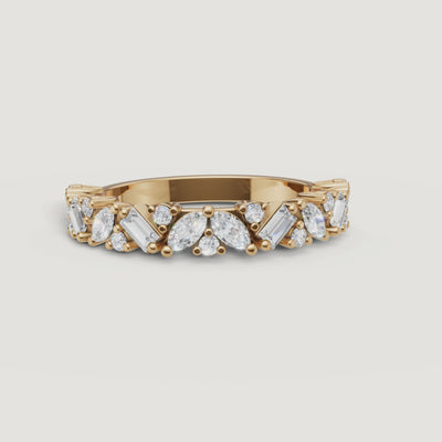 Yellow Gold Video Alt: Rotating video of Raul Diamonds yellow gold mixed diamond wedding band with marquise and baguette cuts