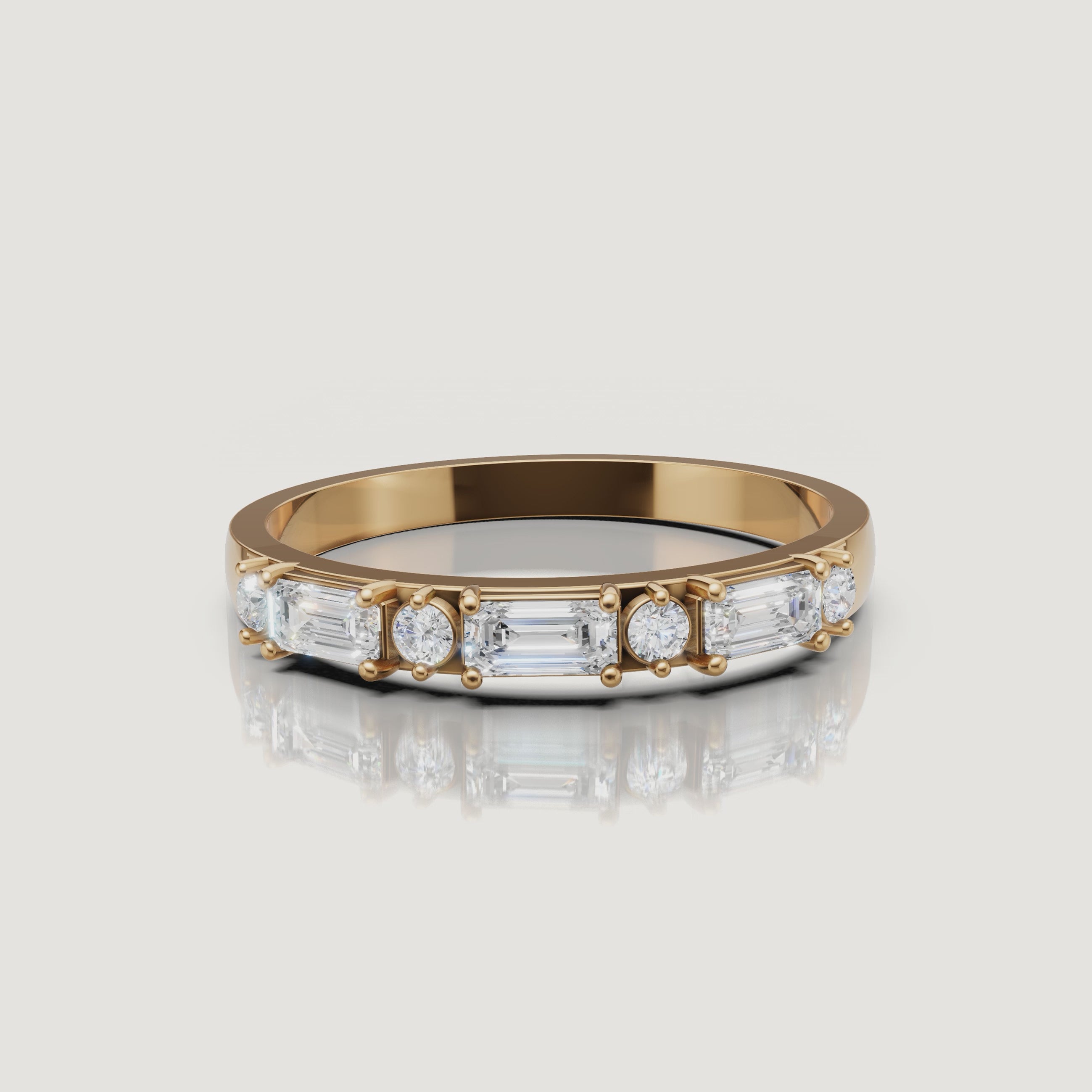 Raul Diamonds yellow gold emerald and round diamond wedding band rotating video with luxury sparkle