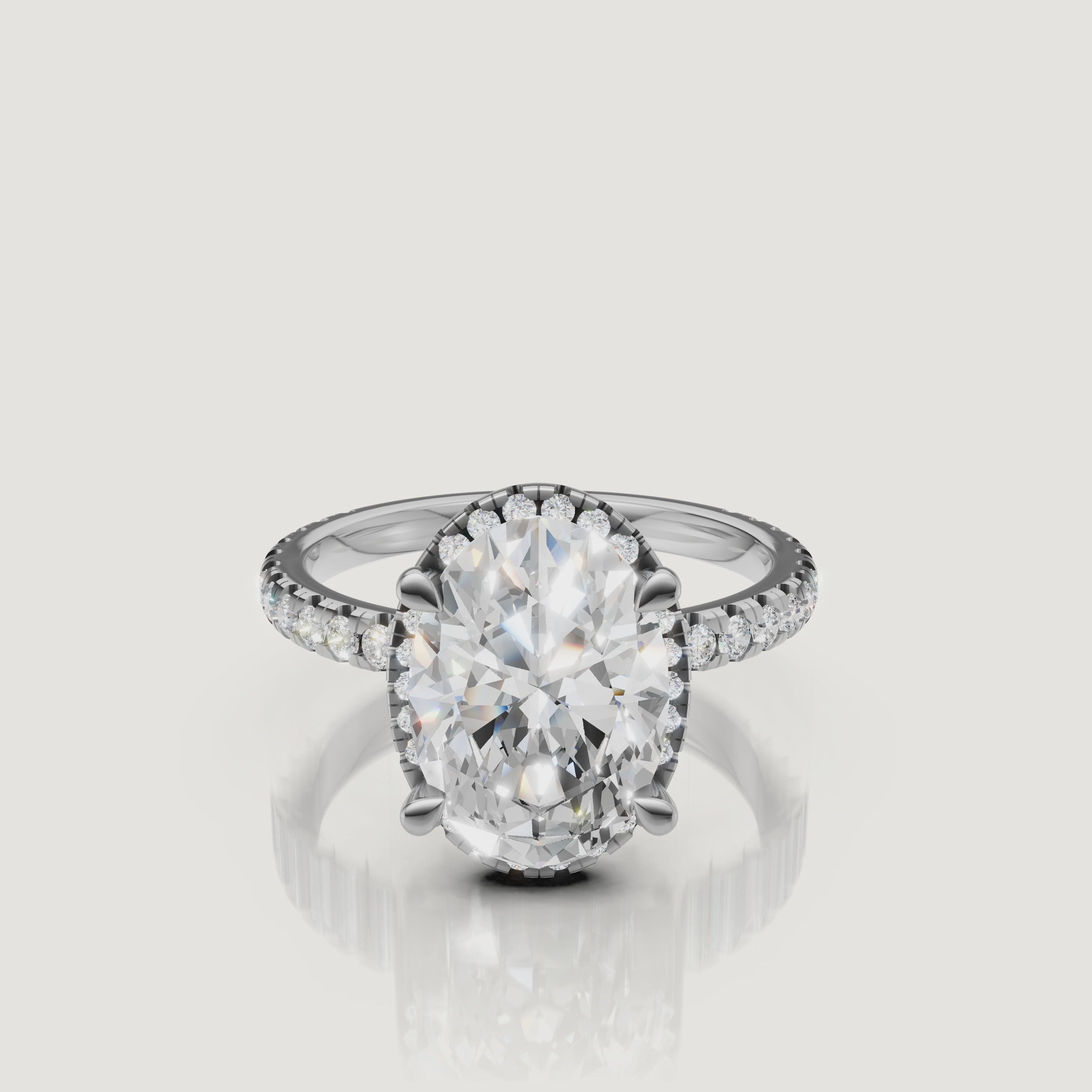 Lifestyle video of the Sophia model wearing a Raul Diamonds white gold Oval engagement ring, emphasizing the brilliant hidden halo and pavé setting.