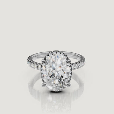 Lifestyle video of the Sophia model wearing a Raul Diamonds white gold Oval engagement ring, emphasizing the brilliant hidden halo and pavé setting.