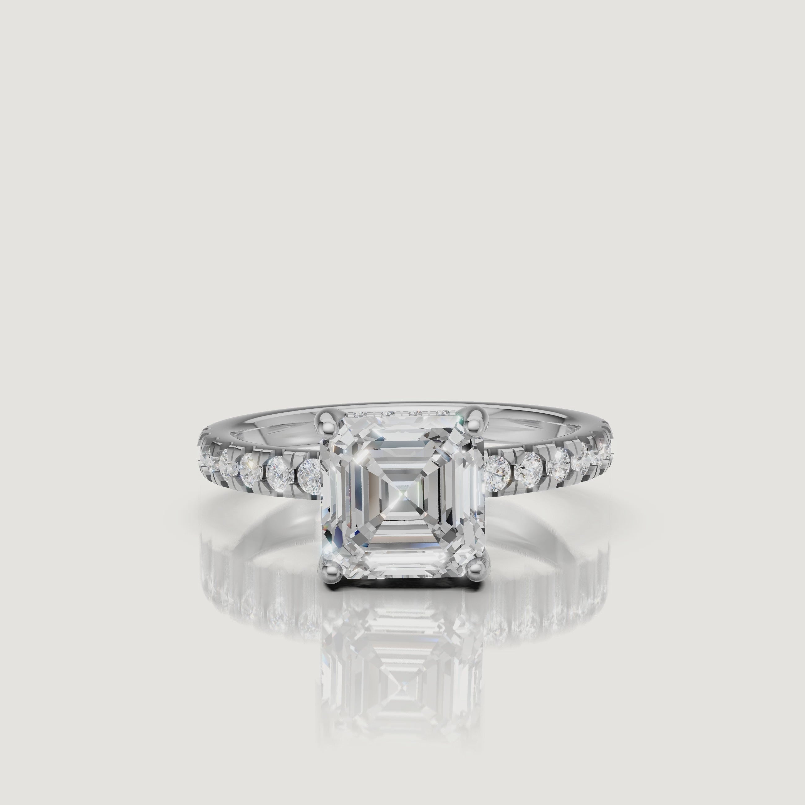 "HD video rotation of a white gold pave-set Asscher cut engagement ring by Raul Diamonds, demonstrating the colorless brilliance and elegant silhouette."