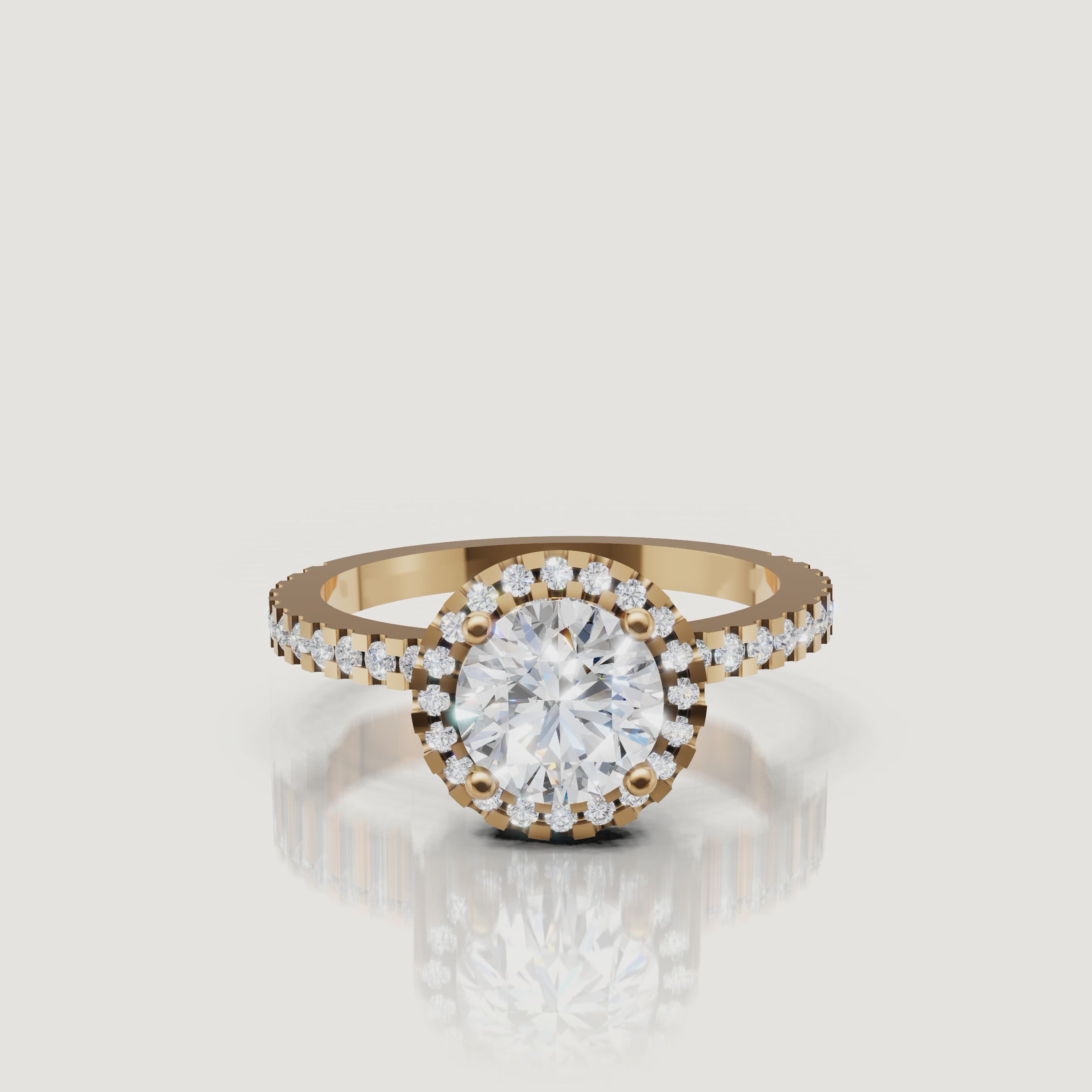 360 video of Raul Diamonds round halo engagement ring in yellow gold with pavé diamond band.