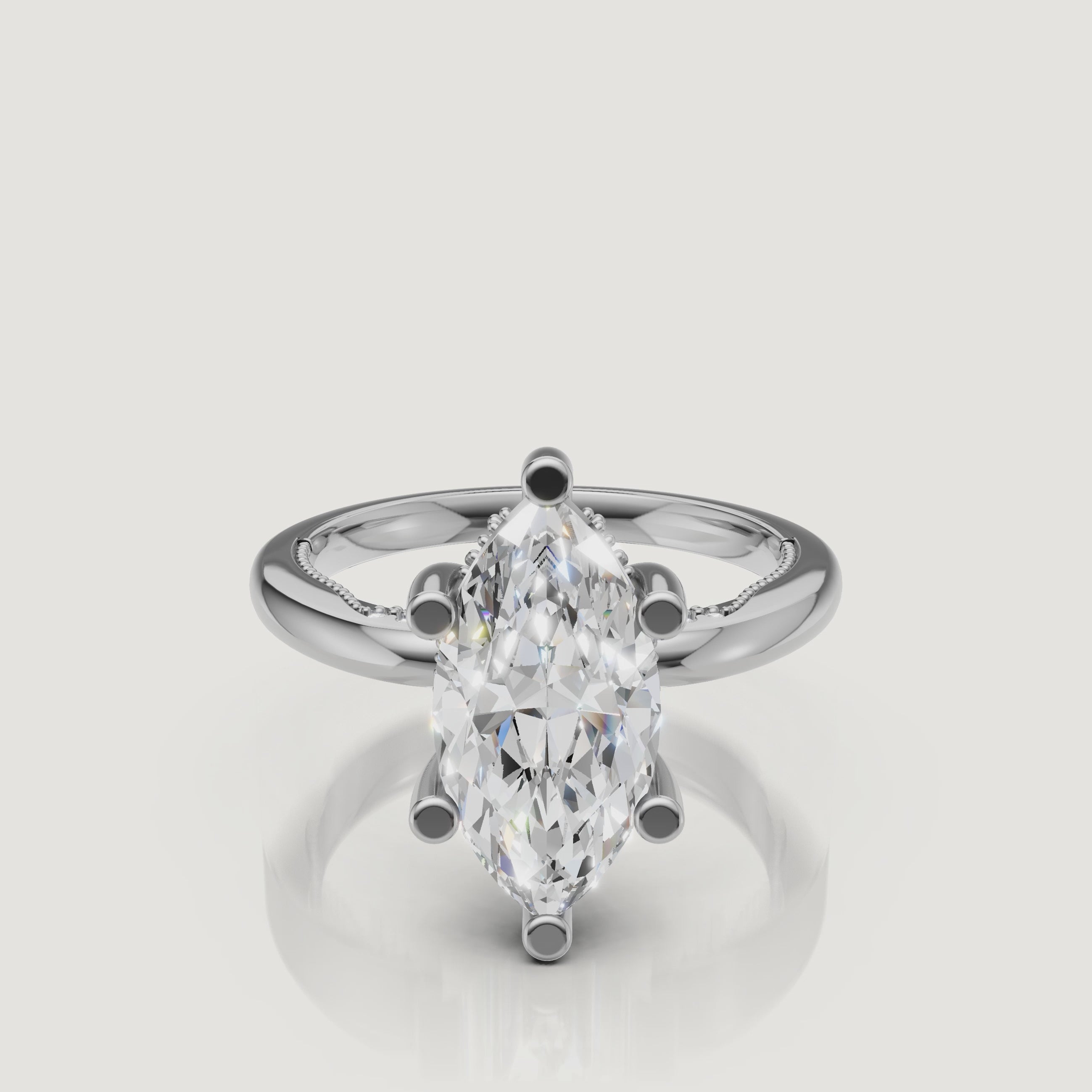 Macro video showcase of a white gold marquise solitaire ring by Raul Diamonds, displaying the sharp, symmetrical lines and incredible white light return