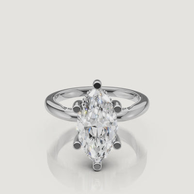 Macro video showcase of a white gold marquise solitaire ring by Raul Diamonds, displaying the sharp, symmetrical lines and incredible white light return