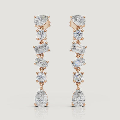 Yellow gold multi shape diamond drop earrings video showcasing pear and emerald cut brilliance by Raul Diamonds