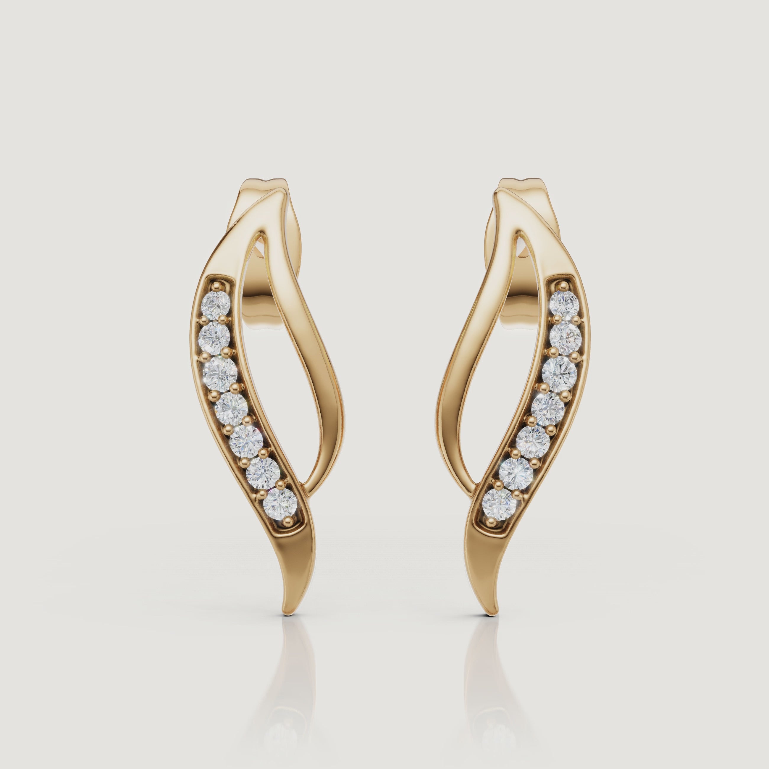 Yellow gold curved diamond stud earrings video showcasing elegant pave sparkle by Raul Diamonds
