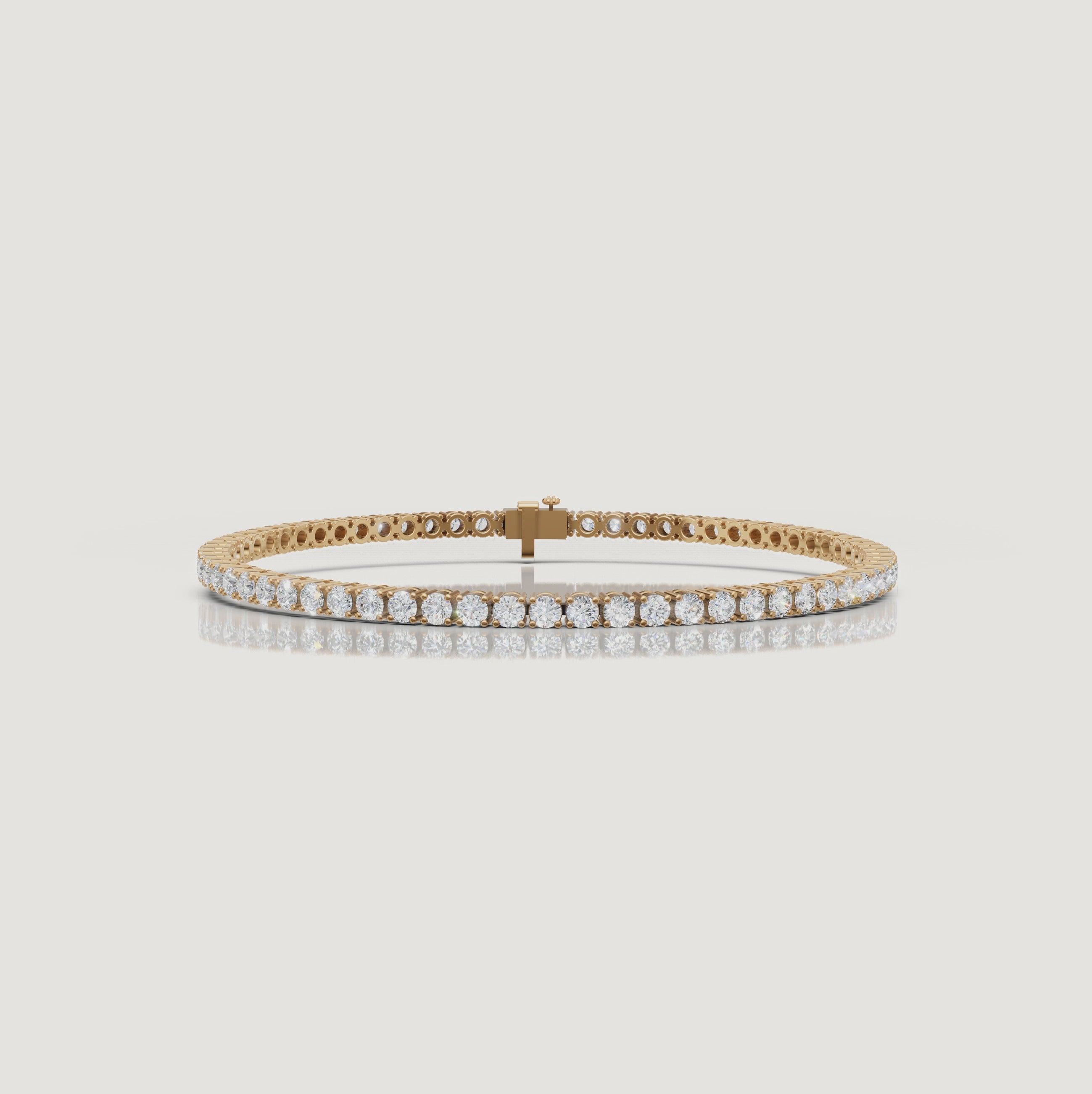 Cinematic video of a 4 carat lab grown diamond tennis bracelet in yellow gold by Raul Diamonds featuring macro diamond sparkle, graceful wrist movement, warm luxury lighting, and timeless fine jewelry elegance for modern women.