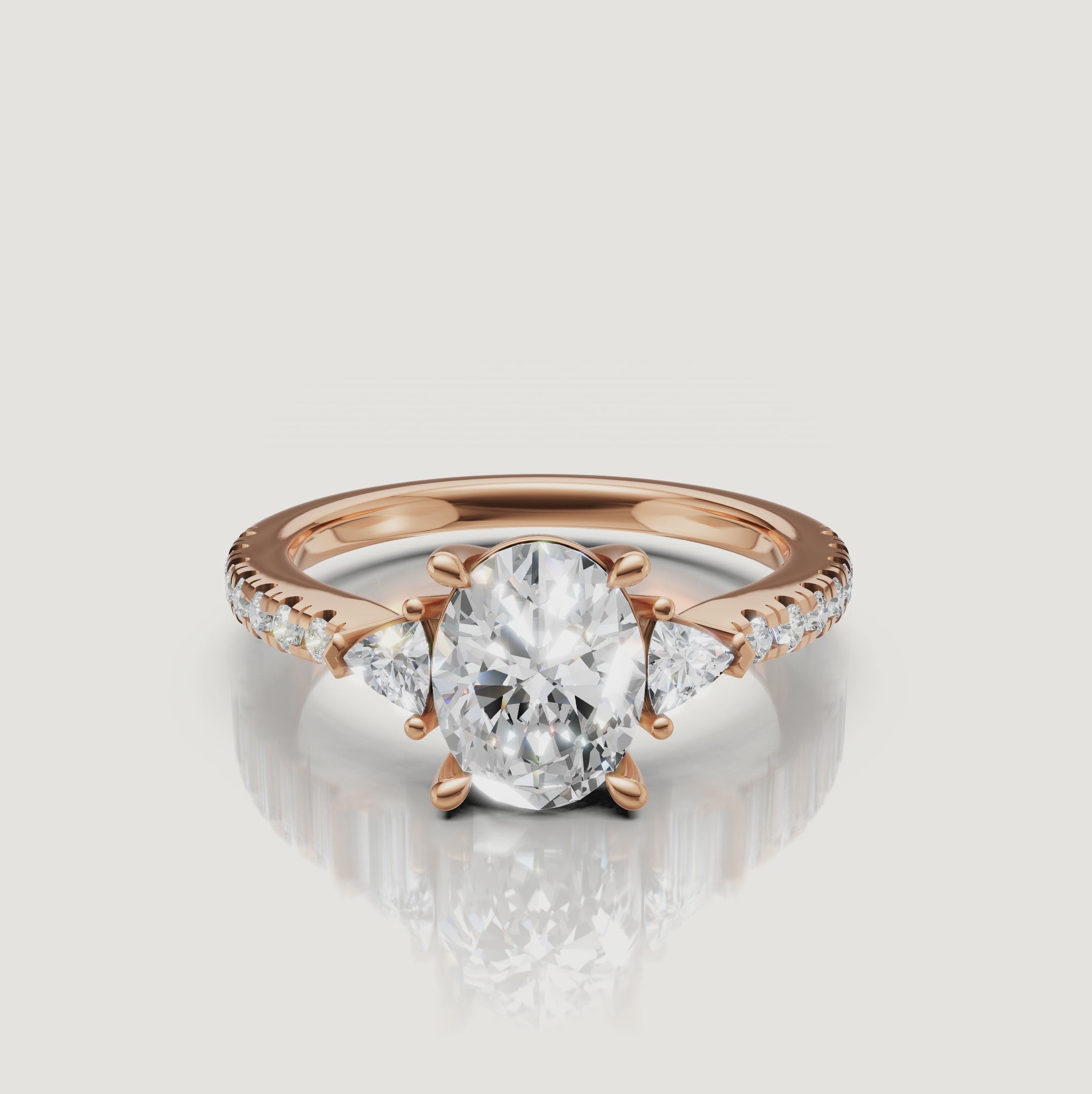 Cinematic close-up of a Rual Diamonds three-stone oval diamond ring, capturing the sparkle and light performance of the pavé-set band.