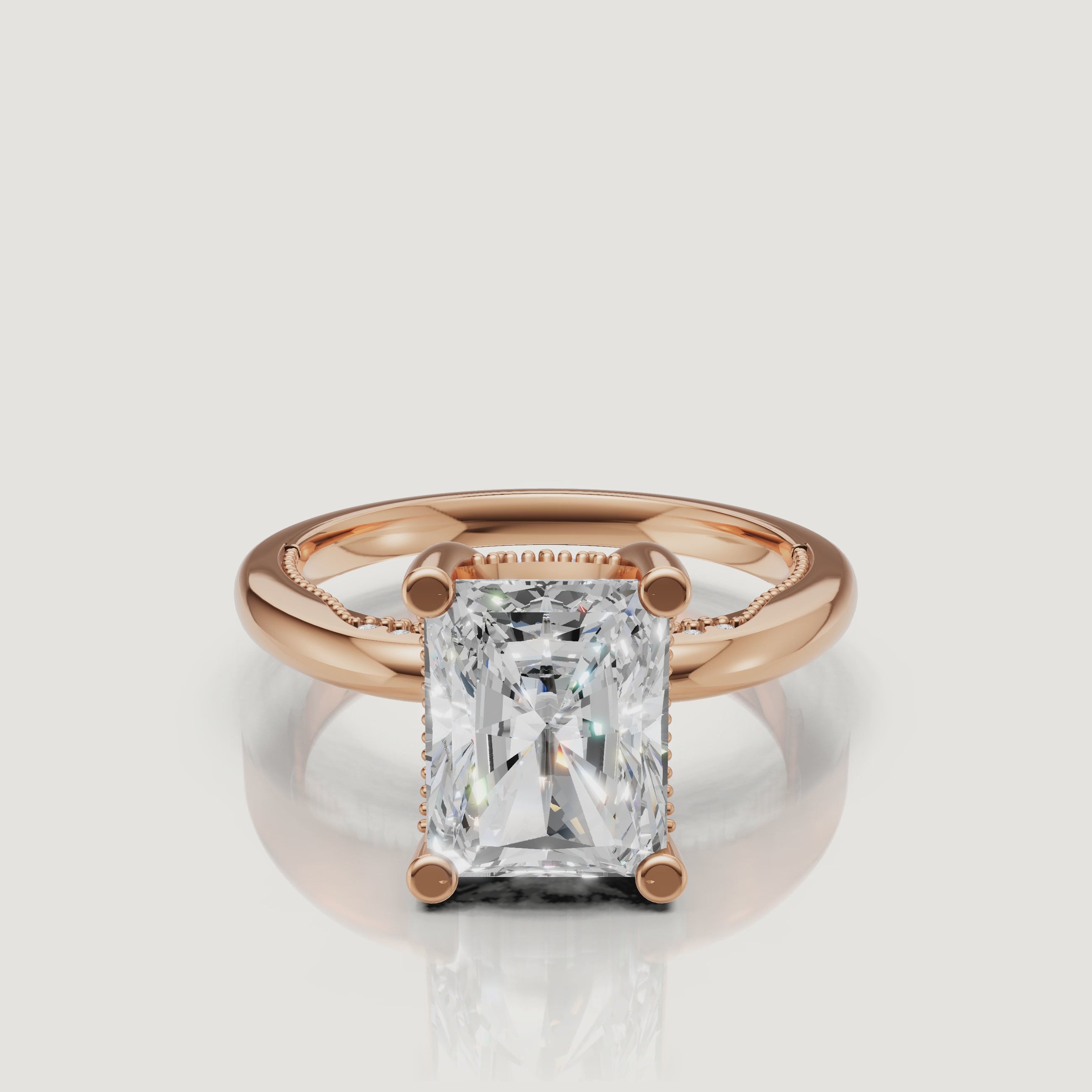 Close-up video of a rose gold radiant cut diamond ring by Raul Diamonds, capturing the romantic blush metal and intense light performance