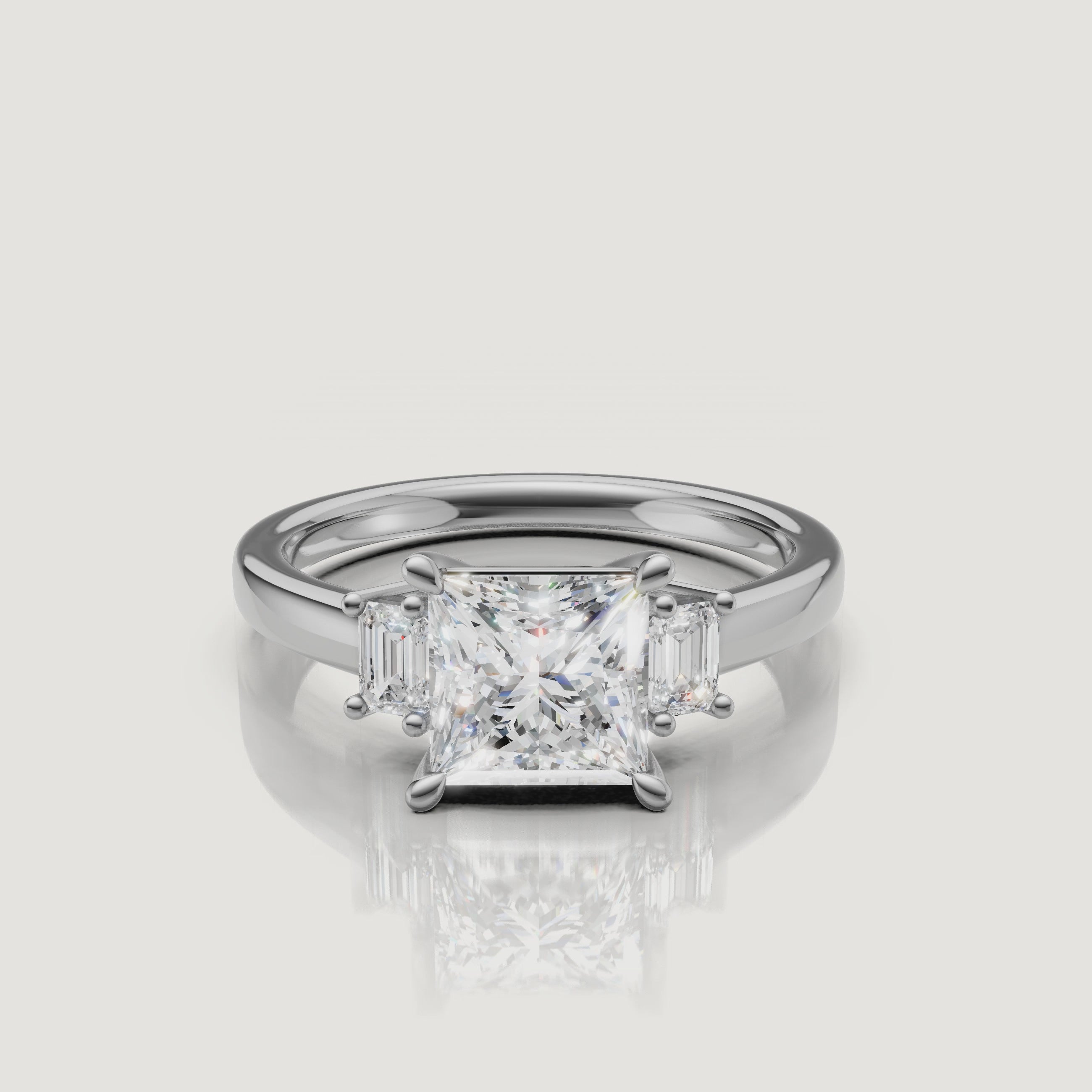 Detailed video walkthrough of the white gold princess cut trilogy ring from Raul Diamonds, demonstrating the brilliant light performance of the three-stone setting with baguette accents.