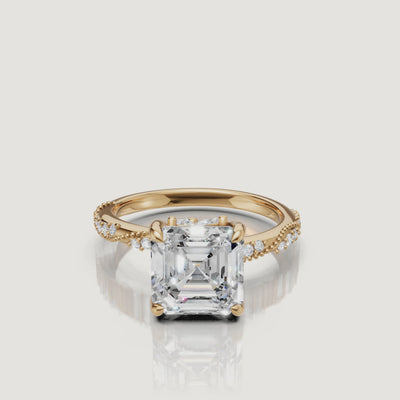 14K yellow gold asscher cut lab grown diamond engagement ring with twisted pavé band sparkling from every angle by Raul Diamonds