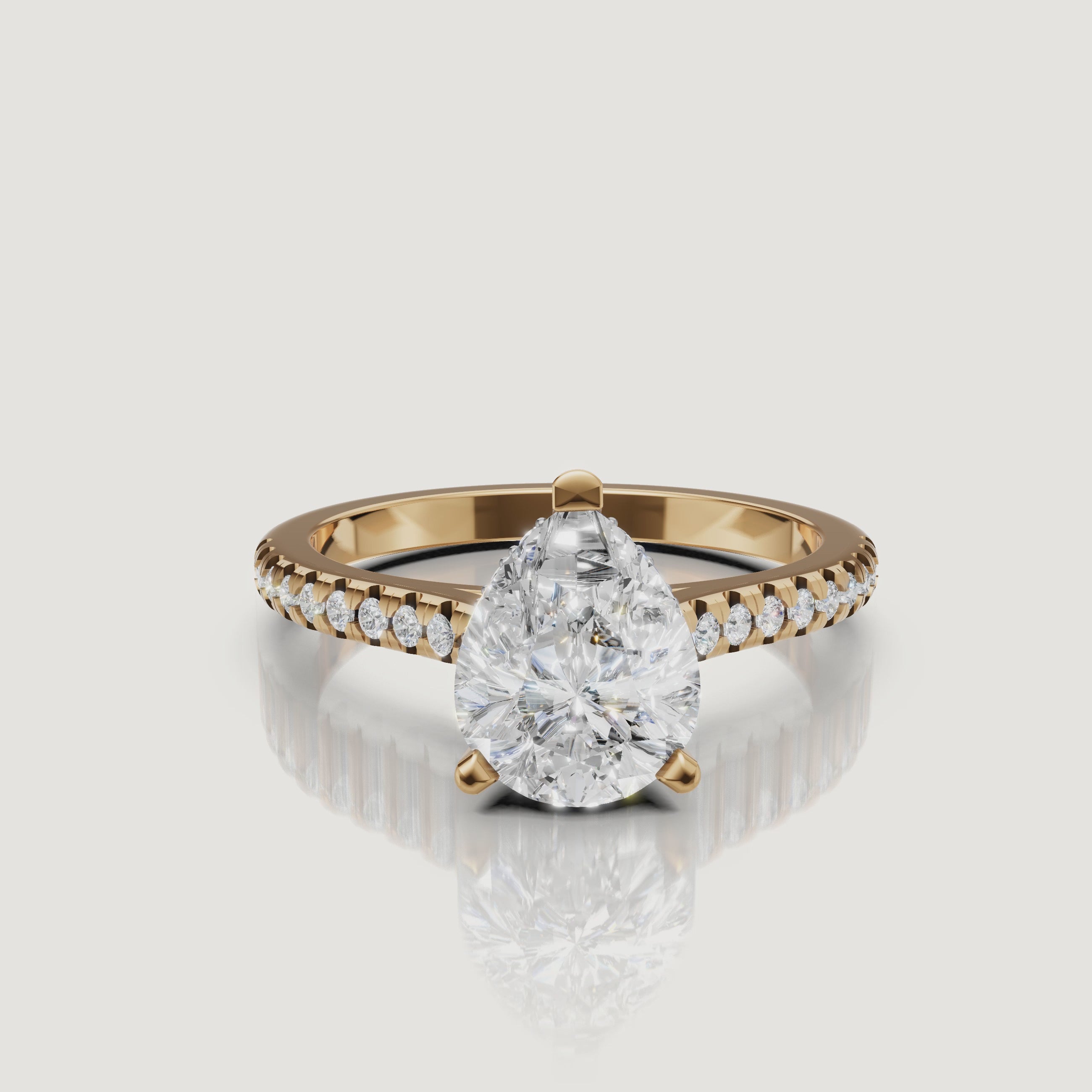360 view of pear cut lab grown diamond pavé engagement ring in 14K yellow gold by Raul Diamonds