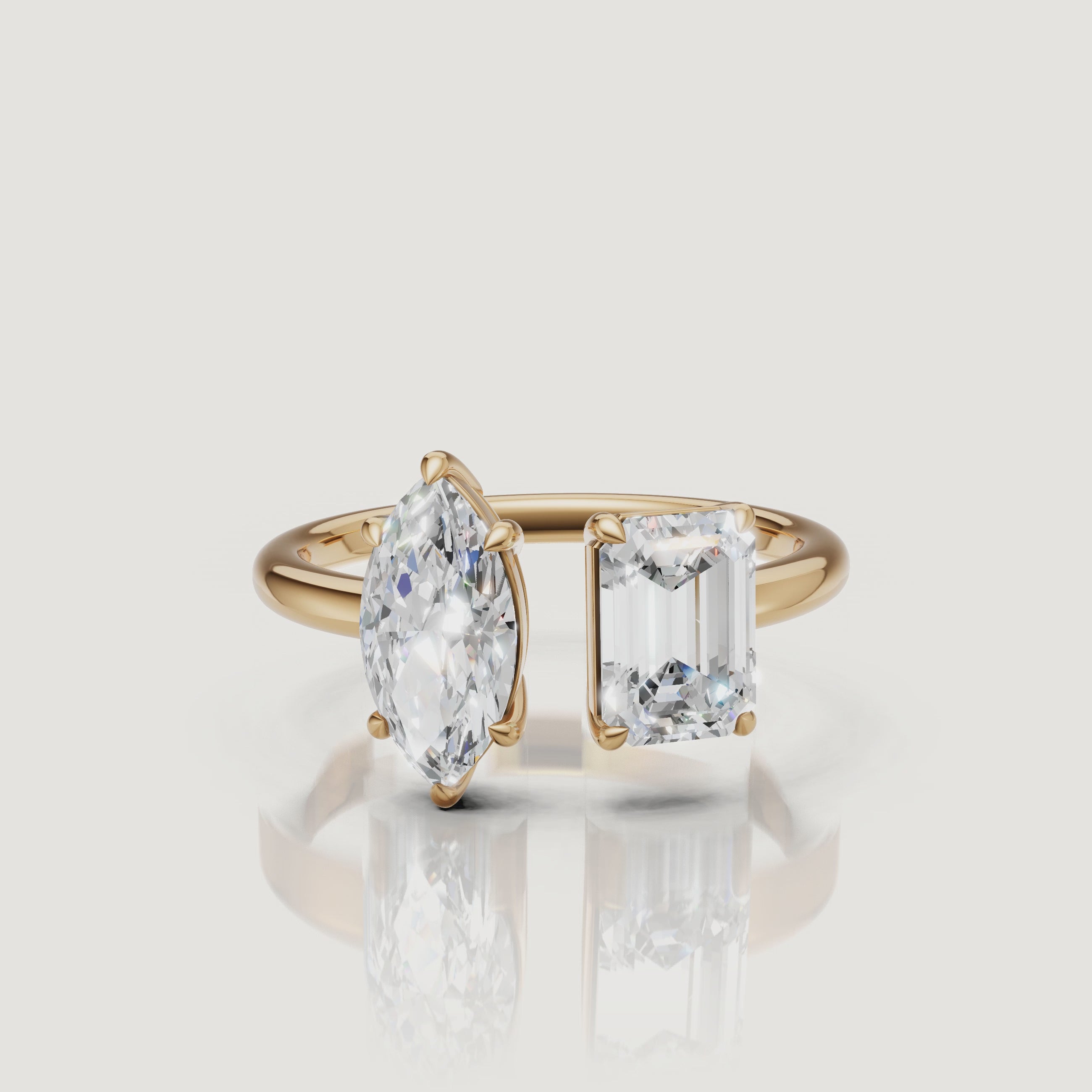 Yellow gold toi et moi diamond ring video featuring marquise and emerald cut stones by Raul Diamonds