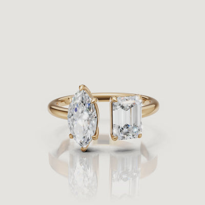 Yellow gold toi et moi diamond ring video featuring marquise and emerald cut stones by Raul Diamonds