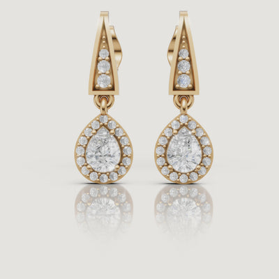 Yellow gold pear halo diamond drop earrings video showcasing elegant brilliance by Raul Diamonds