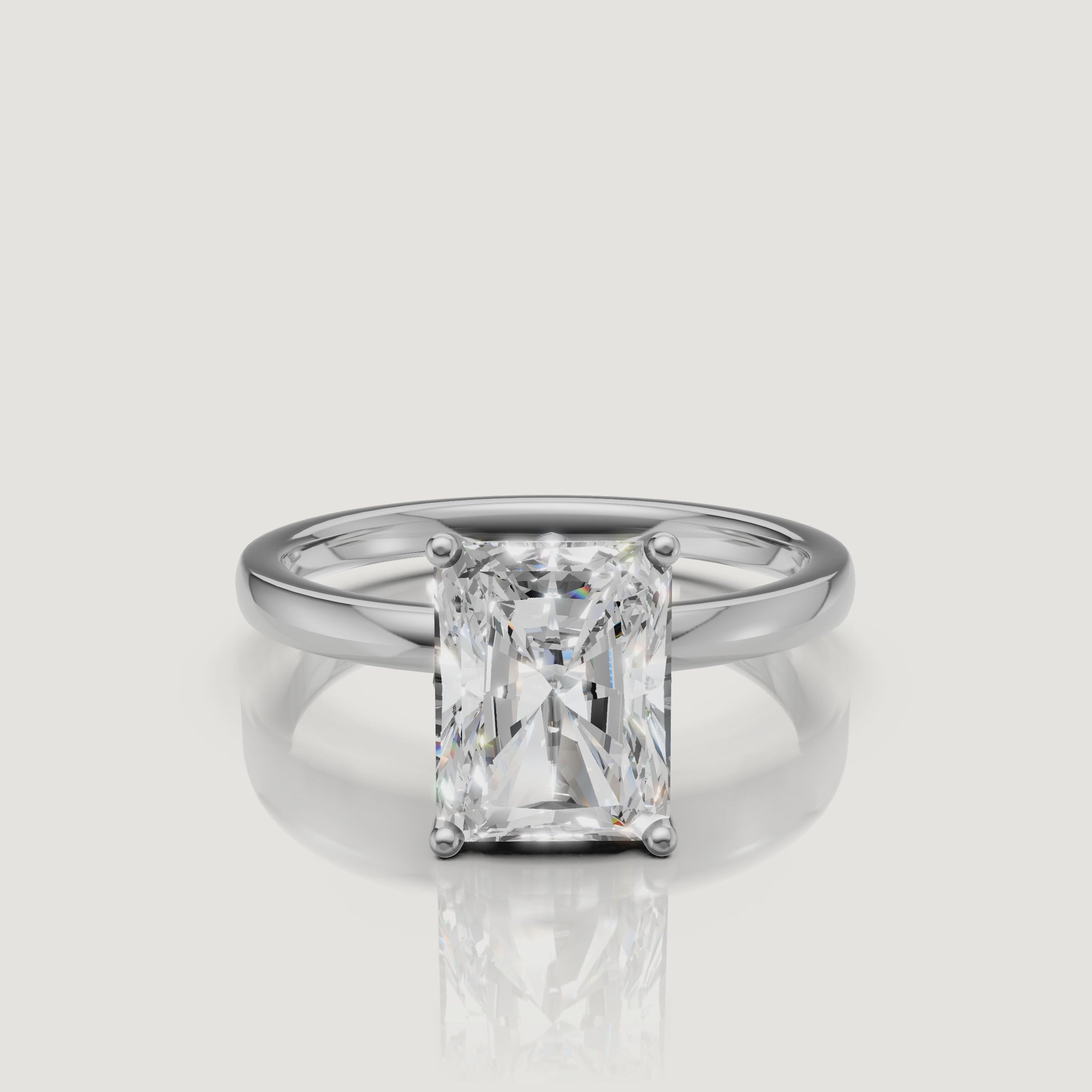 "Cinematic video of a white gold radiant cut solitaire engagement ring from Raul Diamonds, featuring the sleek rectangular silhouette and intense light performance