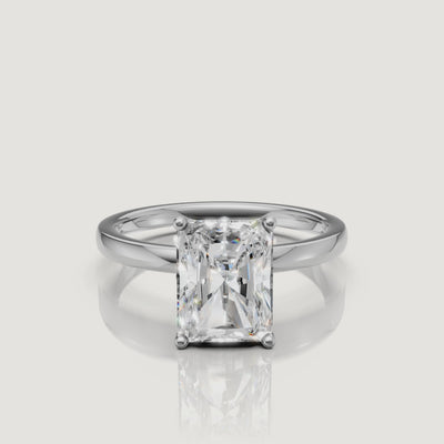 "Cinematic video of a white gold radiant cut solitaire engagement ring from Raul Diamonds, featuring the sleek rectangular silhouette and intense light performance
