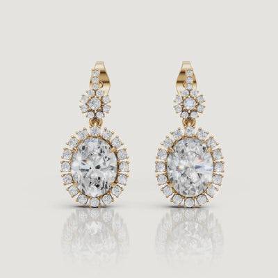 Yellow gold oval halo diamond drop earrings video showcasing vintage luxury brilliance by Raul Diamonds