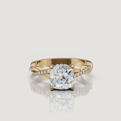 video of cushion cut lab grown diamond bypass engagement ring in 14k gold with pavé diamond crossover band and hidden halo brilliance