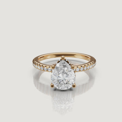 rotating view of pear cut lab grown diamond engagement ring with pavé band