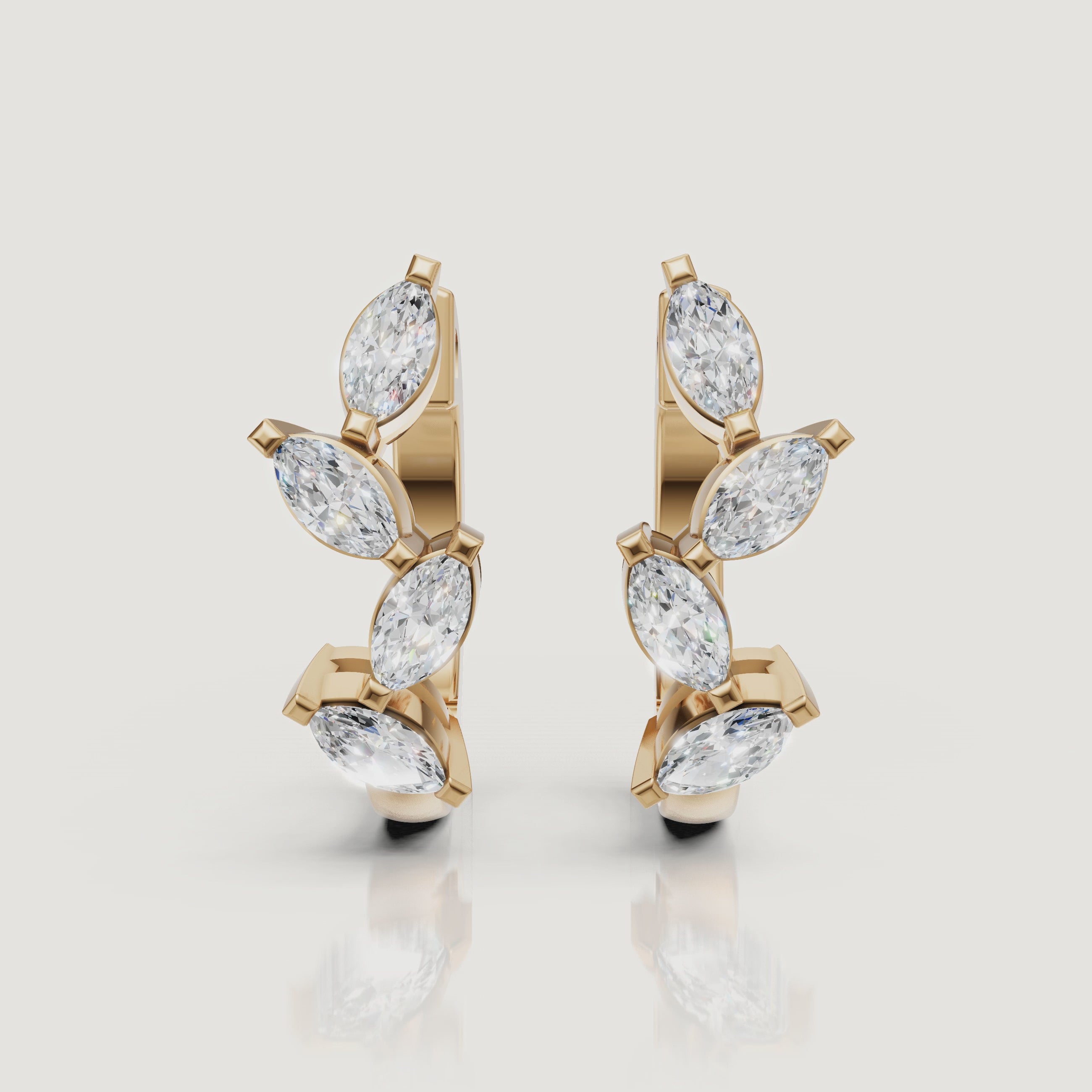 Yellow gold marquise diamond hoop earrings cinematic jewelry video by Raul Diamonds