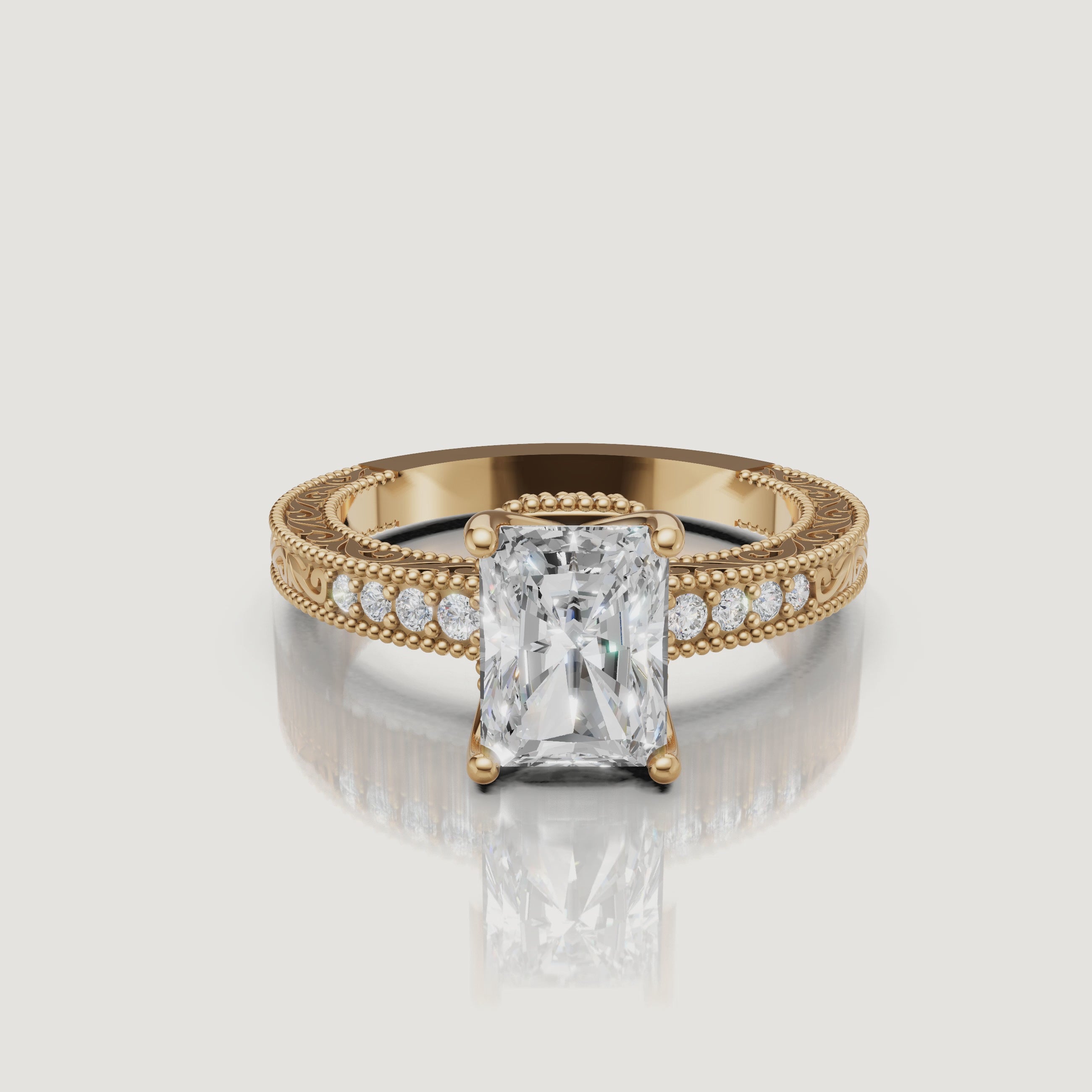 360 video of vintage radiant cut lab grown diamond engagement ring in 14K yellow gold with intricate filigree detailing by Raul Diamonds.