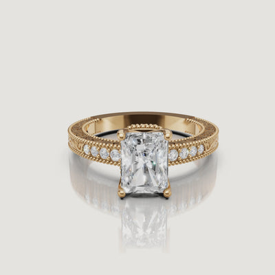 360 video of vintage radiant cut lab grown diamond engagement ring in 14K yellow gold with intricate filigree detailing by Raul Diamonds.