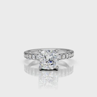 Detail-focused video of a Raul Diamonds white gold cushion-cut engagement ring, showcasing the seamless pavé setting and the colorless brilliance of the center diamond