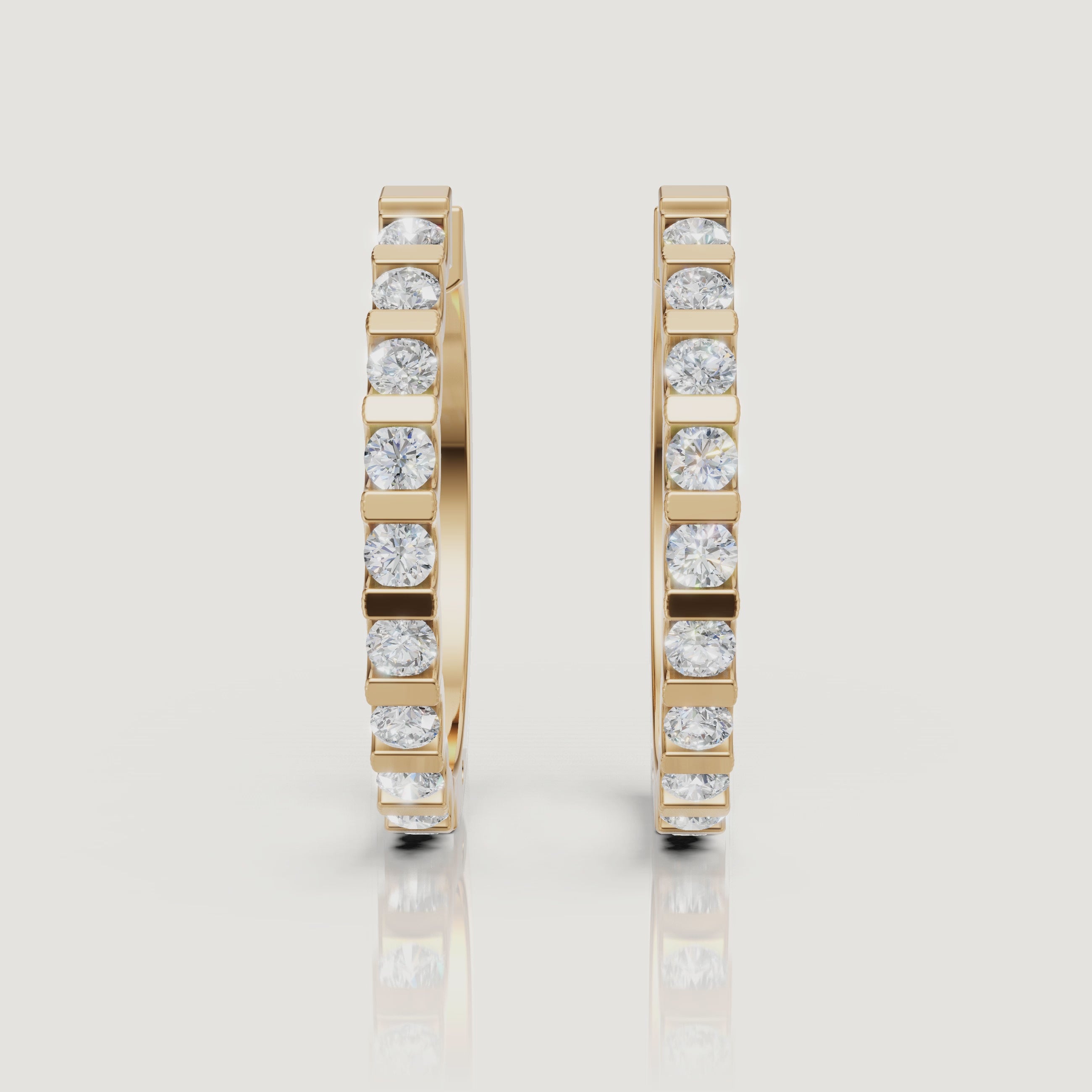Yellow gold bezel set diamond hoop earrings video showcasing elegant brilliance by Raul Diamonds