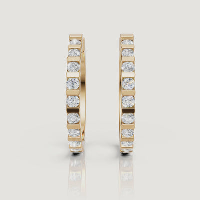 Yellow gold bezel set diamond hoop earrings video showcasing elegant brilliance by Raul Diamonds