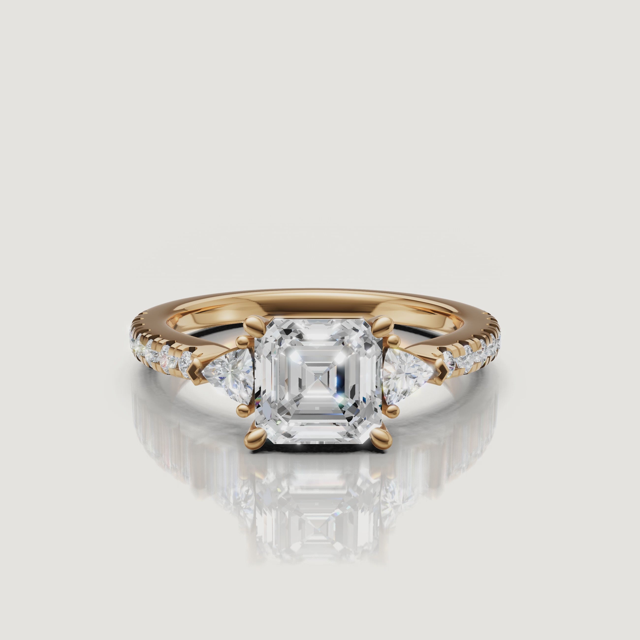 A close-up 360-degree rotation of a Rual Diamonds asscher cut engagement ring, highlighting the deep step-cut facets and brilliant trillion-cut side stones.