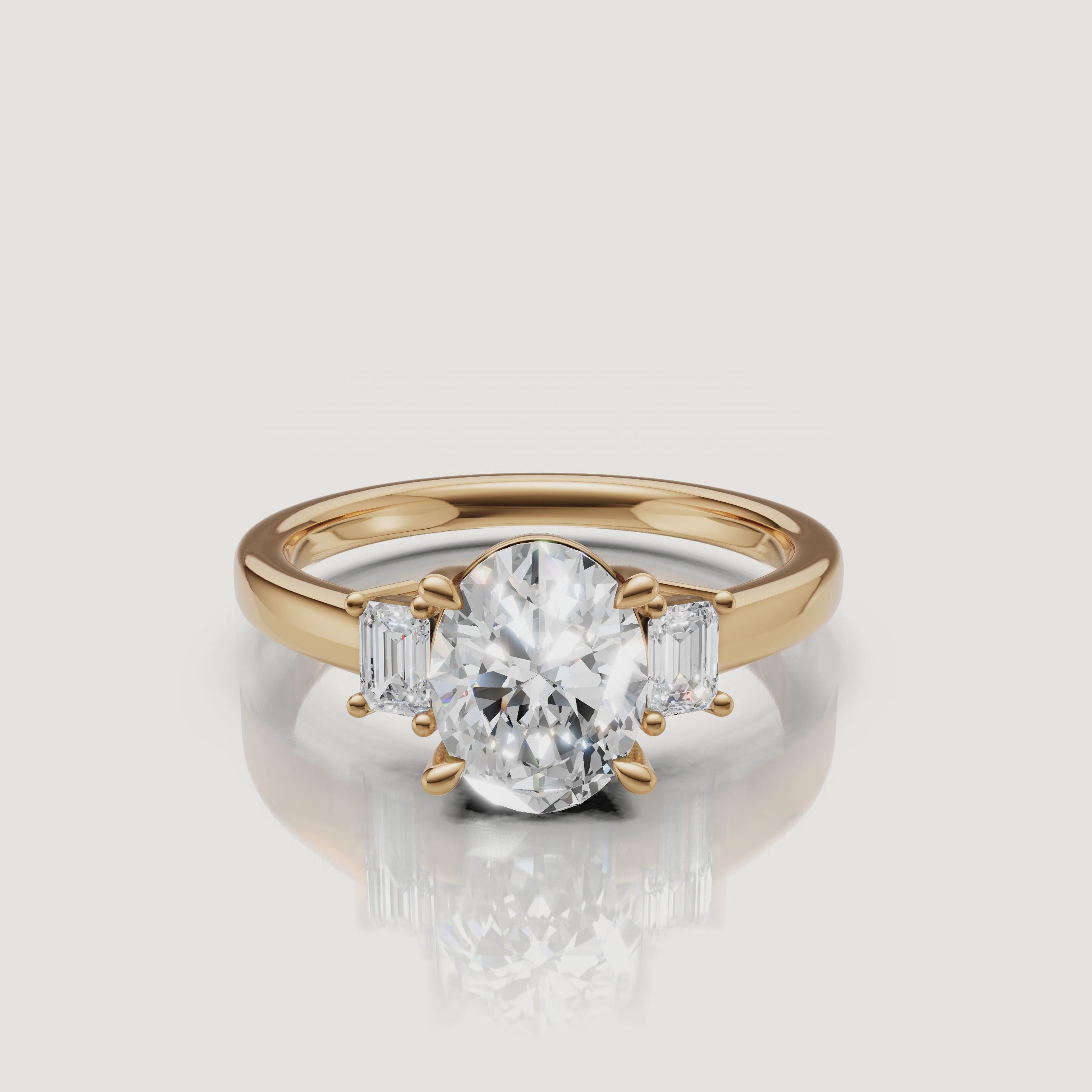 360-degree video showcase of a Raul Diamonds yellow gold engagement ring featuring a brilliant oval-cut center diamond and emerald-cut side stones, sparkling under studio lighting