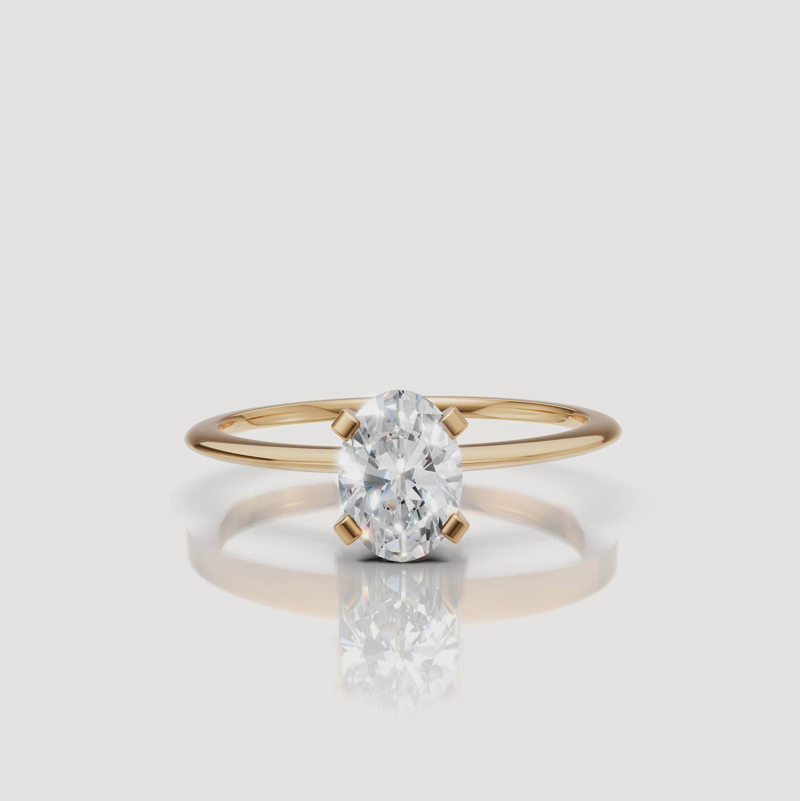 Cinematic video of an oval cut lab grown diamond solitaire engagement ring in yellow gold by Raul Diamonds featuring elegant hand movement, macro diamond sparkle, warm luxury lighting, and premium bridal jewelry styling