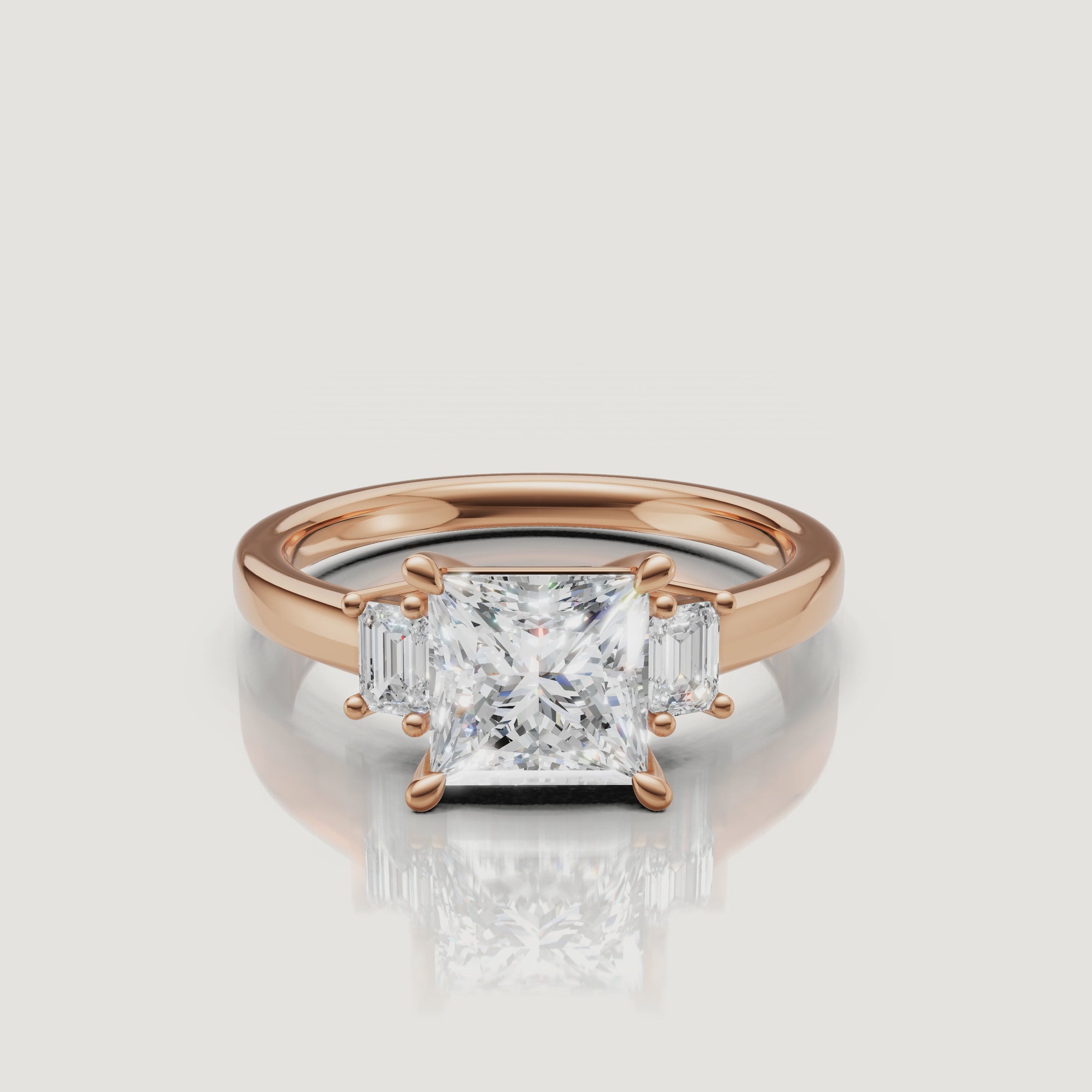 HD video featuring the rose gold princess cut three-stone diamond ring by Raul Diamonds, focusing on the warm metal tones and the clear reflection of the side baguette diamonds.